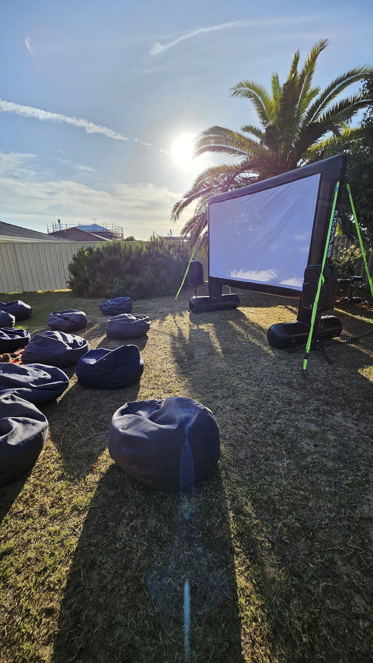 Perth Pop-Up Movies crew setting up the inflatable cinema screen and sound