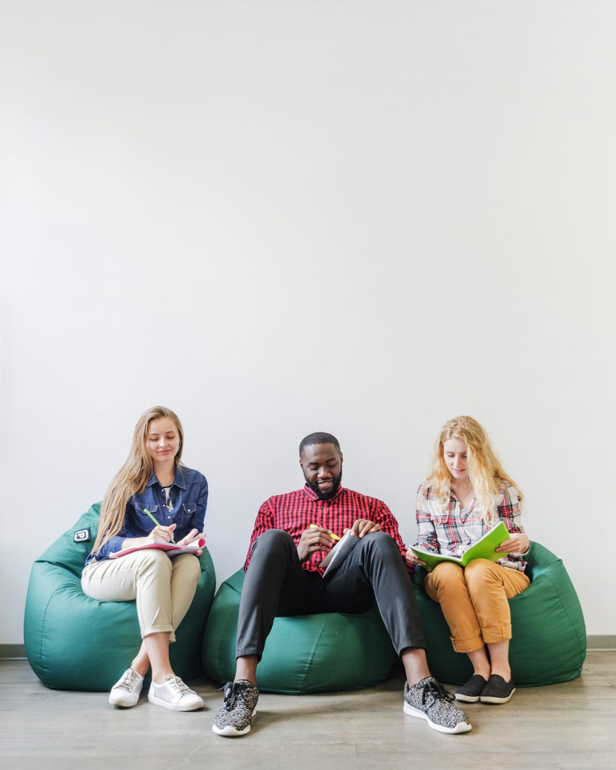Group of friends sitting together on bean bags