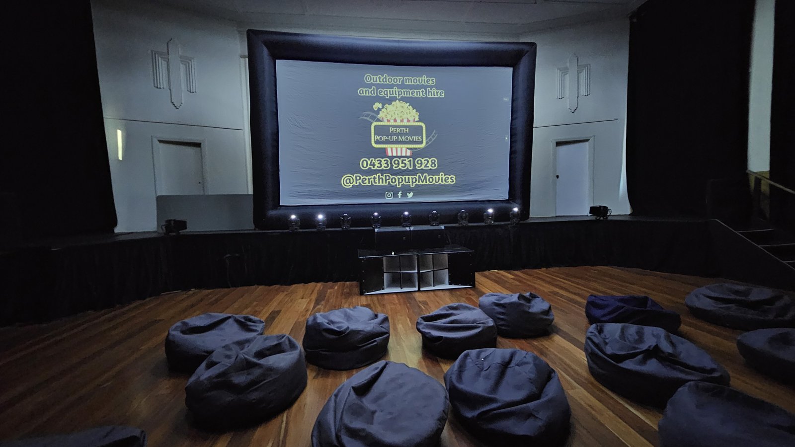 Outdoor cinema hire in Applecross: 5m community cinema screen with bean bag seating set up by Perth Pop-Up Movies
