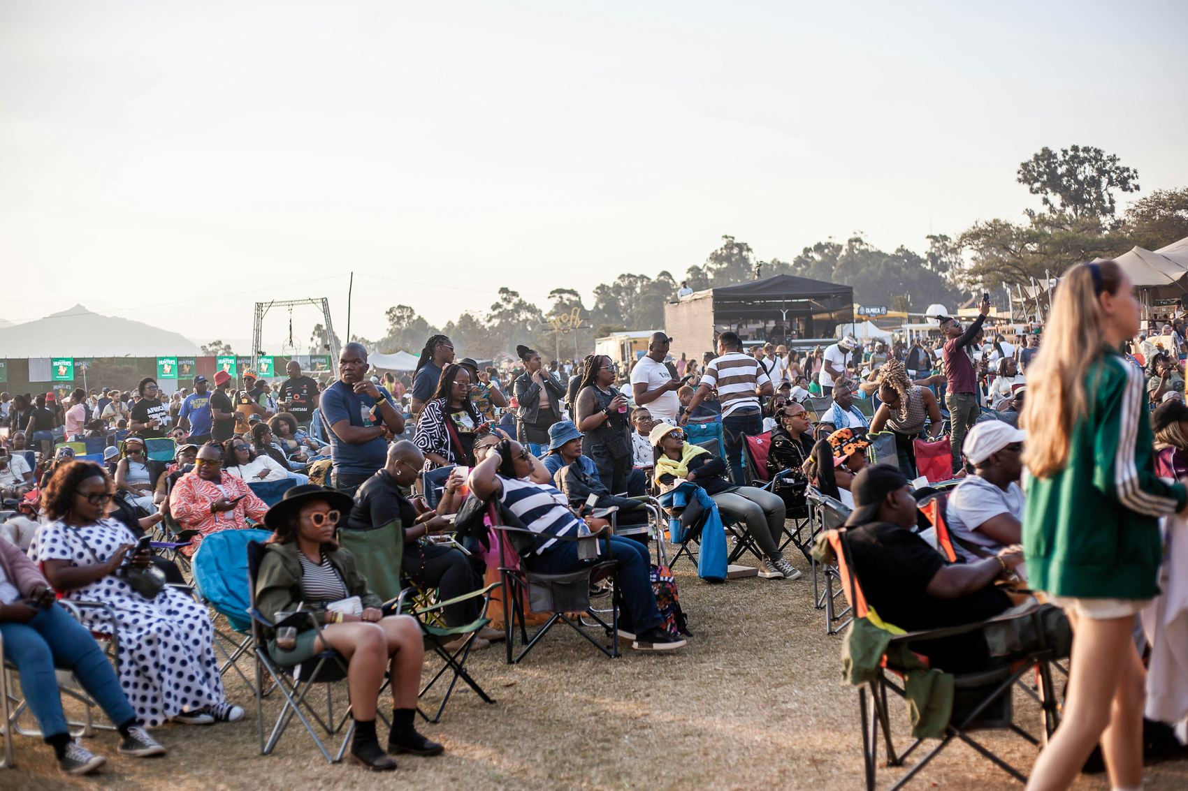 A festival crowd at an outdoor event in Perth at dusk