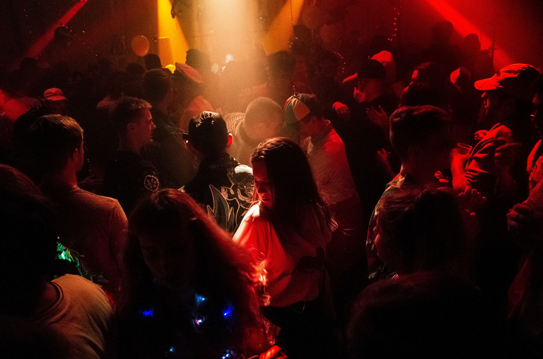 A lively party crowd under coloured lighting in Perth