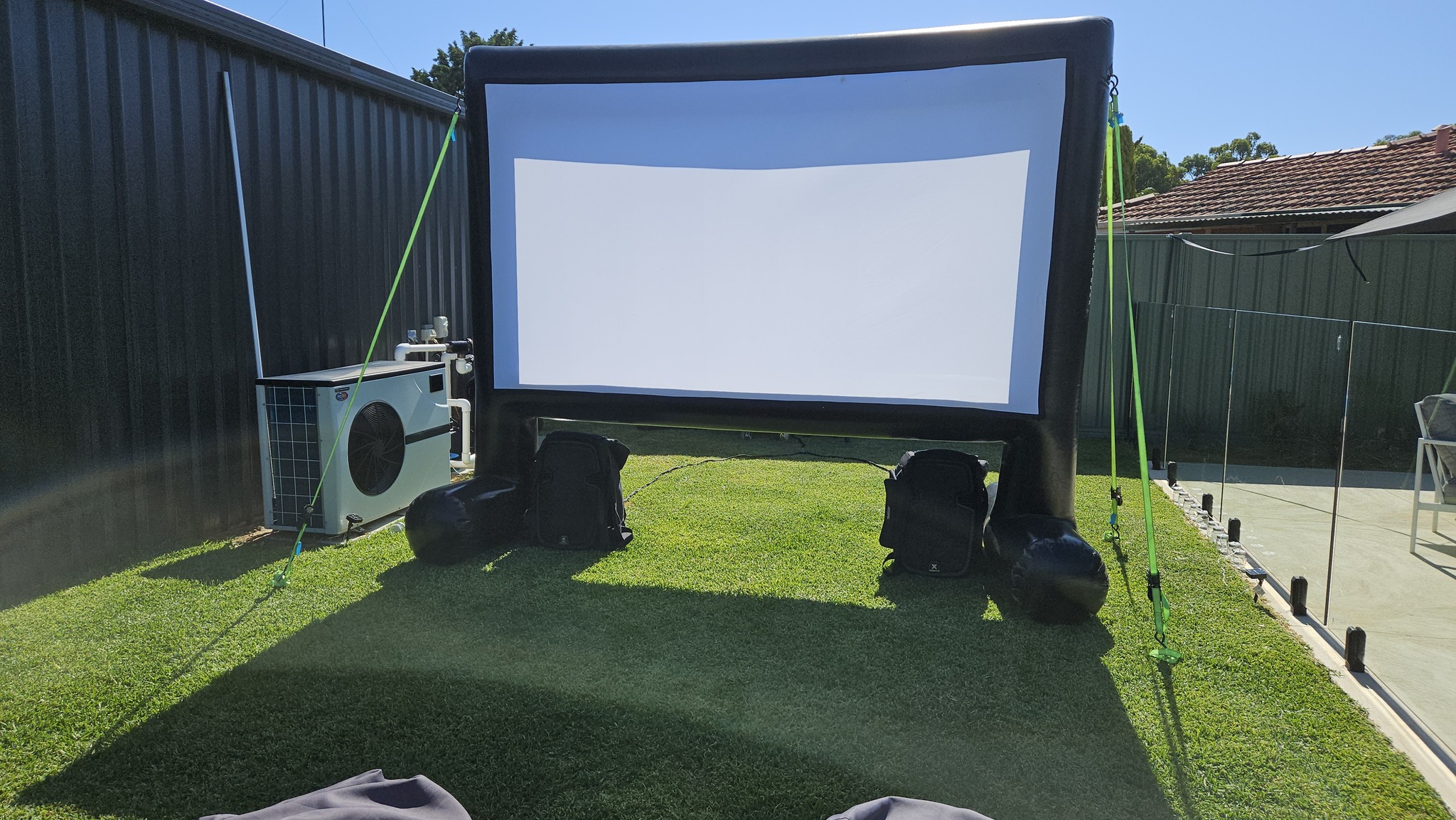 Backyard movie night Perth setup — cinema screen and projector ready to go