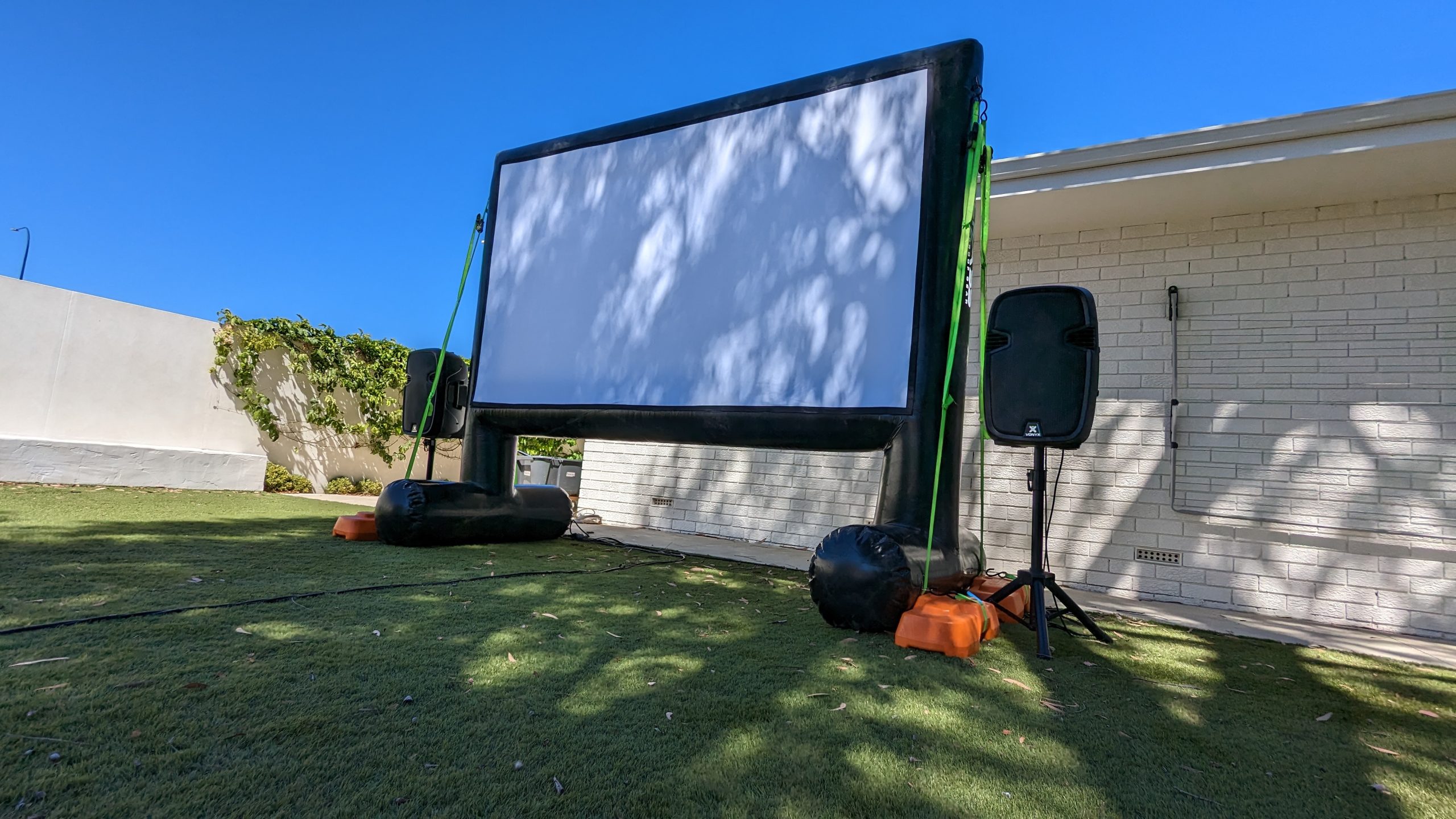 Birthday cinema hire Perth screen and projector set up in a backyard