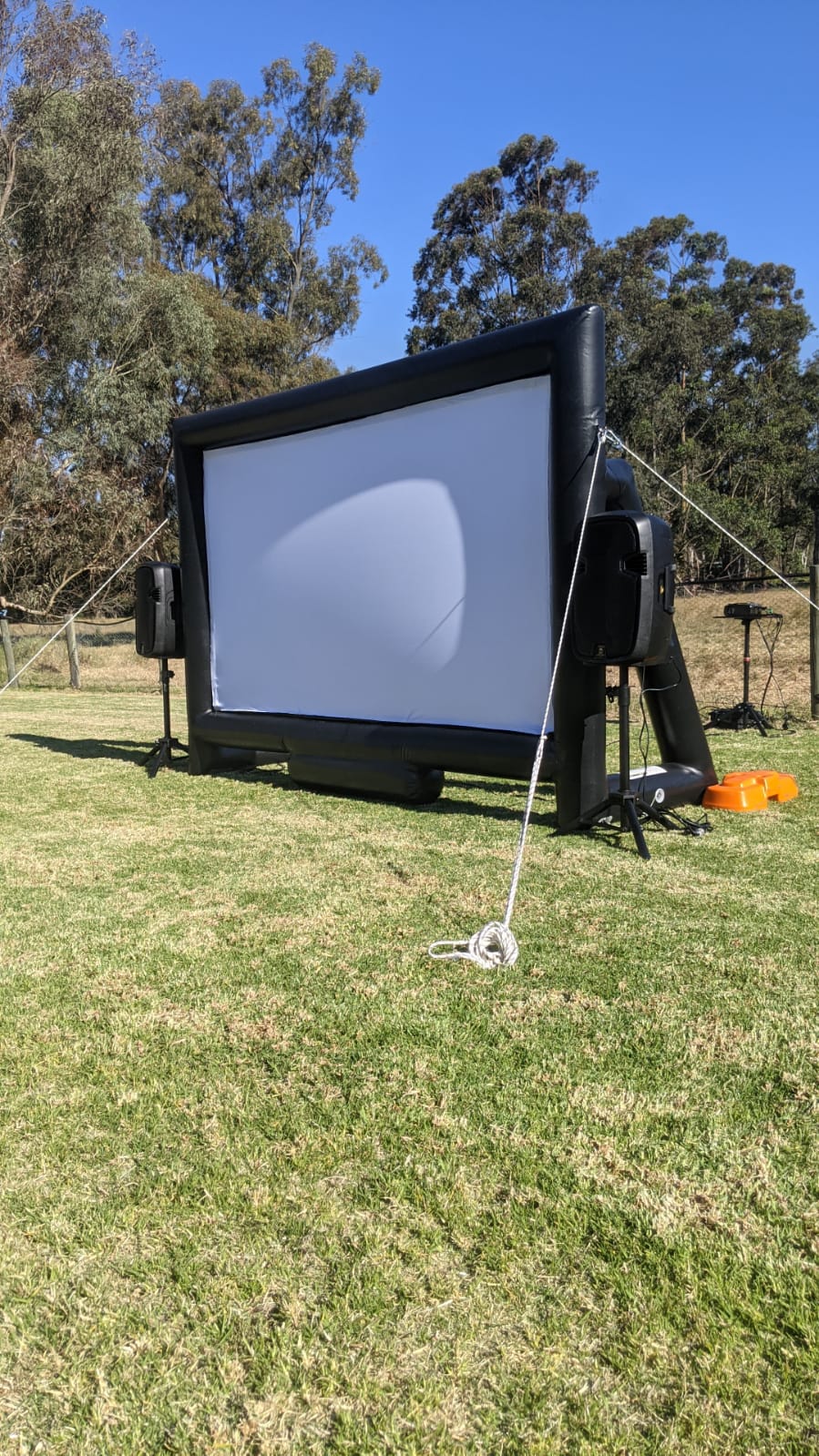 Backyard cinema Perth celebrations — inflatable screen setup at night